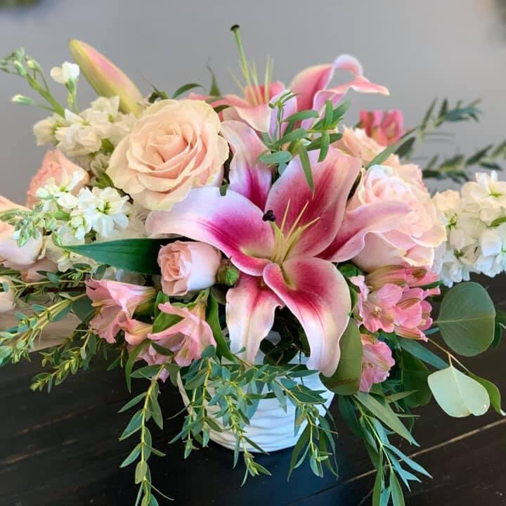 white container with foam pink lilies pink and white